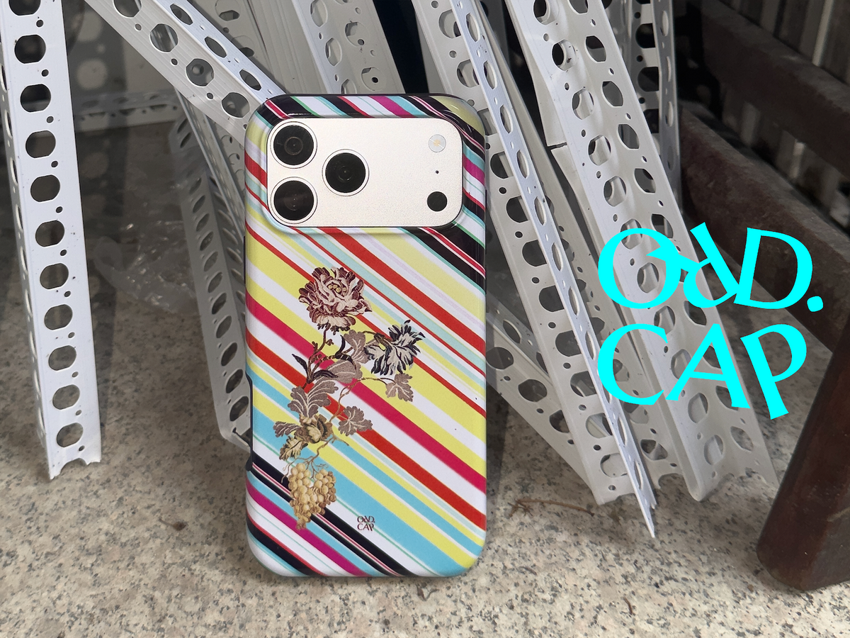 Garden Index striped floral MagSafe phone case in an overhead fruit still life