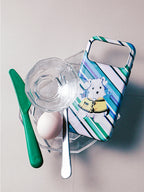Dog on an Errand striped dog MagSafe phone case in a styled still life