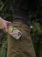 Apple for Later striped apple MagSafe phone case in a lifestyle setting