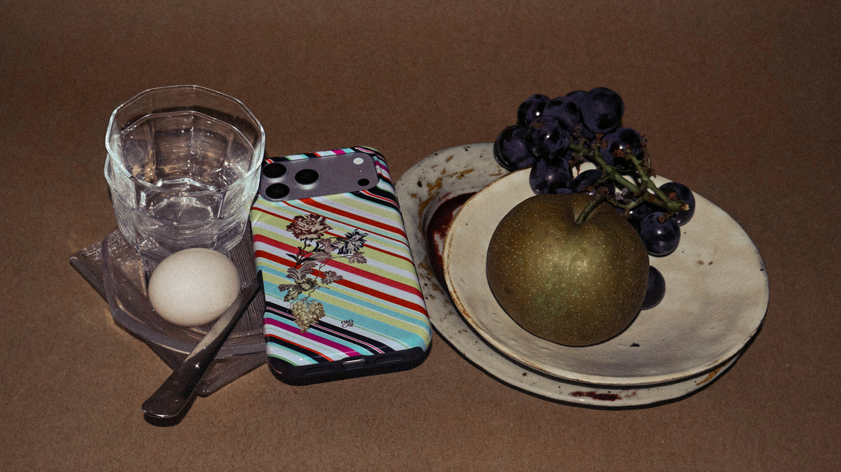 ORD.CAP phone cases arranged with fruit and tableware