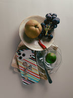 Garden Index striped floral MagSafe phone case with fruit and tableware