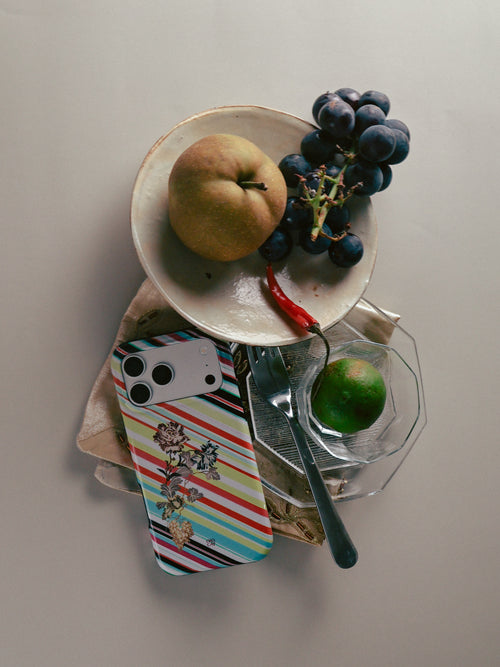 Garden Index striped floral MagSafe phone case with fruit and tableware