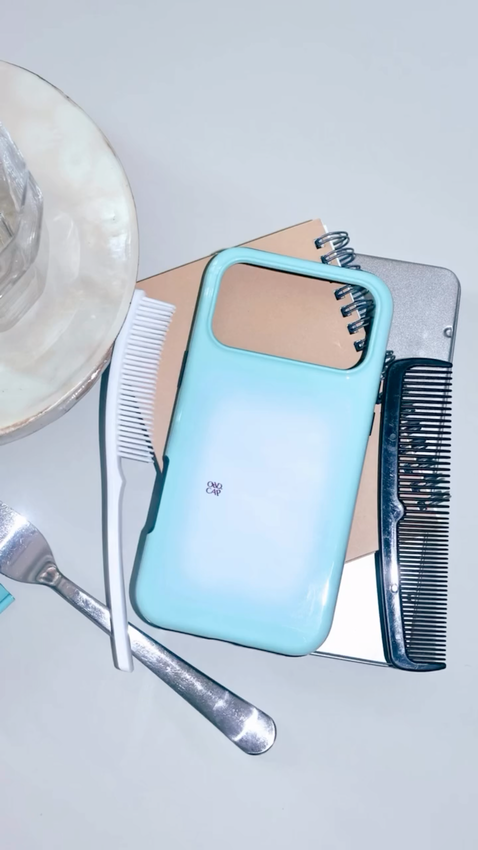 Lunch table leftovers with a blue ORD.CAP phone case.