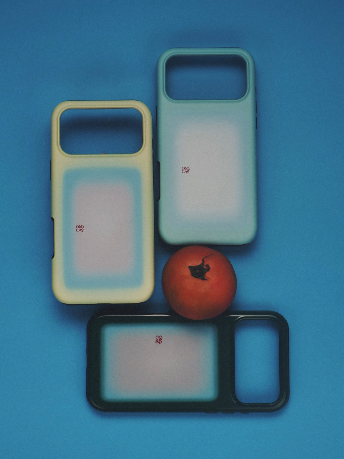 Night Window phone case arranged on blue